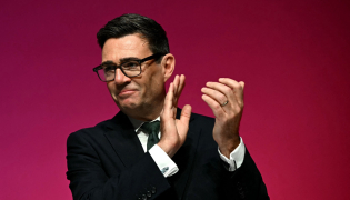 Britain's Prime Minister Andy Burnham applauds on the final day of the annual Labour Party conference in Liverpool, north-west England, on September 30, 2026. (Photo by Paul ELLIS / AFP)