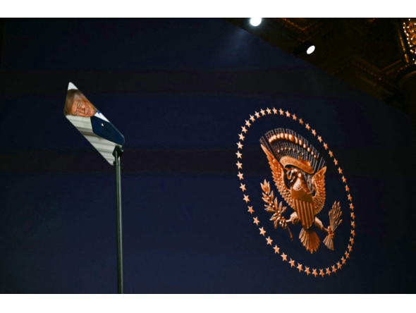 US President Donald Trump is reflected in a teleprompter as he attends an event to unveil the new America.gov website, at the Andrew W. Mellon Auditorium in Washington, DC, on September 29, 2026. (Photo by Kent Nishimura / AFP)
 
