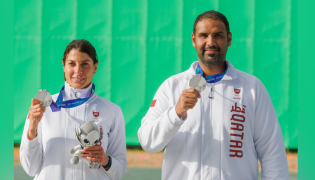 Qatar's Ray Bassil and Mohammed Al-Rumaihi celebrate with their medals on the podium. 