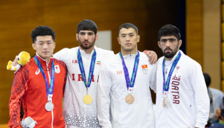 FROM LEFT: Japan’s Nao Kusaka (silver), Iran’s Alireza Abdevali (gold), and bronze winners Akzhol Makhmudov of Kyrgyzstan’s and Qatar’s Shahin Mohammed on the podium.