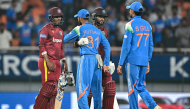 West Indies' captain Shai Hope (2R) and Gudakesh Motie (L) greet India's Ruturaj Gaikwad (2L) and captain Shubman Gill at the end of the third one-day international (ODI) cricket match between India and West Indies at the Maharaja Yadavindra Singh International Cricket Stadium on the outskirts of Chandigarh on October 3, 2026. (Photo by Sajjad HUSSAIN / AFP)