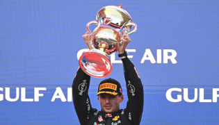 Race winner Red Bull Racing's Dutch driver Max Verstappen lifts his trophy during podium ceremony of the Formula One Bahrain Grand Prix in Sepang on October 4, 2026. (Photo by Jade Gao / AFP)