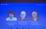 Screen displays portraits of (L-R) US scientist Karl Deisseroth and German scientists Peter Hegemann and Georg Nagel during the announcement of the winners of the 2026 Nobel Prize in Physiology or Medicine at the Karolinska Institute in Stockholm, Sweden, on October 5, 2026. Photo by Jonathan Nackstrand / AFP