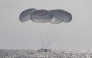 This picture provided by NASA shows the SpaceX Crew Dragon Freedom spacecraft as it lands with NASA astronauts Jessica Meir, Jack Hathaway, ESA (European Space Agency) astronaut Sophie Adenot, and Roscosmos cosmonaut Andrey Fedyaev aboard in the Pacific Ocean off the coast of Los Angeles, California, on October 8, 2026. Photo by Keegan Barber / NASA / AFP