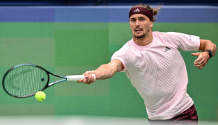 Germany's Alexander Zverev hits a return to China's Wu Yibing during their men's singles match at the Shanghai Masters tennis tournament in Shanghai on October 9, 2026. (Photo by Hector RETAMAL / AFP)