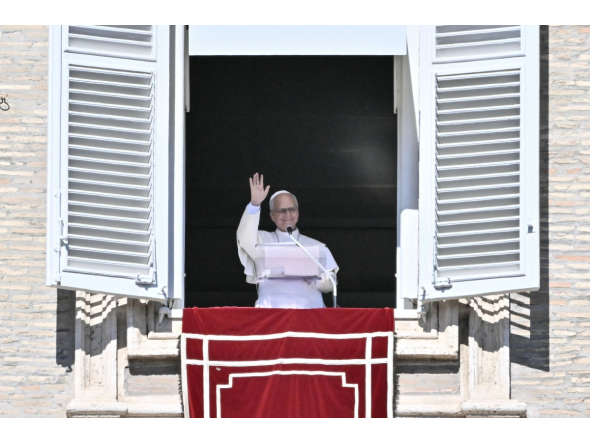 Pope Leo XIV waves to faithful during the Angelus prayer from the window of the Apostolic Palace overlooking St. Peter's Square, in the Vatican, on October 11, 2026. (Photo by Filippo MONTEFORTE / AFP)