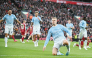 Manchester City’s Erling Haaland (right) celebrates after scoring the opening goal.