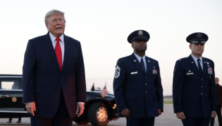 US President Donald Trump talks with members of the media after landing at Youngstown Air Reserve Station on October 12, 2026 in Vienna, Ohio. Alex Wong/Getty Images/AFP