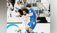 Al Sadd's Akram Afif (left) controls the ball during the match.