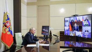 In this pool photograph distributed by the Russian state agency Sputnik, Russia's President Vladimir Putin chairs a meeting on cybersecurity with government and business members via videolink at the Novo-Ogaryovo residence outside Moscow on October 14, 2026. (Photo by Mikhail METZEL / POOL / AFP)
