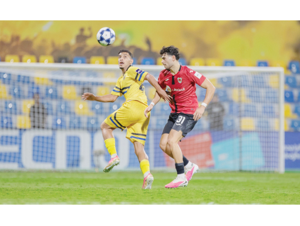 Action during the match between Al Rayyan and Al Taawoun.