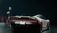 A grab taken on October 16, 2026 from a live feed released by Tesla shows Tech billionaire Elon Musk unveiling on October 15 the next-generation Roadster electric car in McGregor, Texas, United States. (Photo by Tesla / AFP)