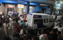 An ambulance carrying Durga Puja Pandal stampede victims stops in front of the emergency building of Calcutta Medical College and Hospitalas relatives of Durga Puja Pandal stampede victims mourn in Kolkata on October 16, 2026. (Photo by AFP)