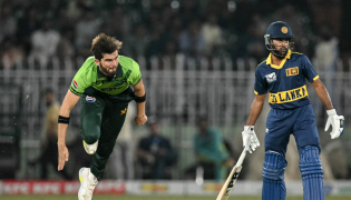 Pakistan's captain Shaheen Shah Afridi (L) bowls as Sri Lanka's Pavan Rathnayake watches during the tri-series one-day international (ODI) cricket match between Pakistan and Sri Lanka at the Rawalpindi Cricket Stadium in Rawalpindi on October 18, 2026. (Photo by Aamir QURESHI / AFP)