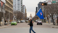 An Alberta separatist supporter carries a flag ahead of the referendum in downtown Edmonton, Alberta, on October 19, 2026. (Photo by Megan Albu / AFP)