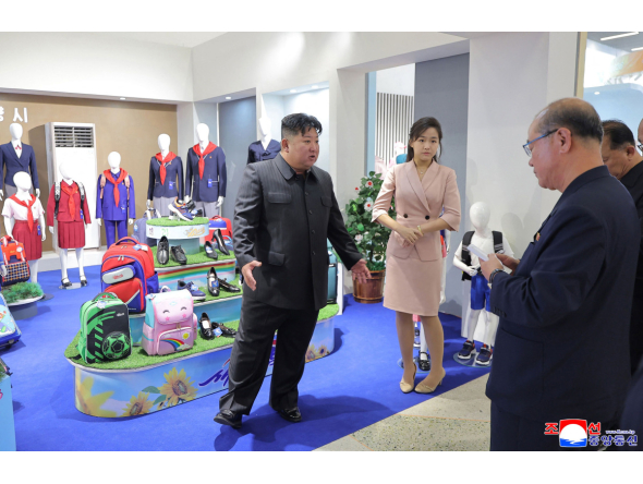 This picture taken on October 19, 2026 and released by North Korea's official Korean Central News Agency (KCNA) on October 20, 2026 shows North Korean leader Kim Jong Un (L) and his daughter Kim Ju Ae (2nd L) inspecting a clothing and footwear exhibition hall in Pyongyang. (Photo by KCNA VIA KNS / AFP) 