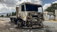 A truck belonging to the Tigray People's Liberation Front (TPLF) stands burned along a road following clashes between Ethiopian federal forces and armed groups opposed to the government in Adigrat on October 17, 2026. (AFP)

