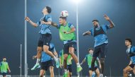 Al Ahli players take part in a training session.