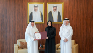 Minister of Education and Higher Education H E Lolwah bint Rashid bin Mohammed Al Khater presenting accreditation certificate to President of UDST Dr. Salem Al-Naemi.