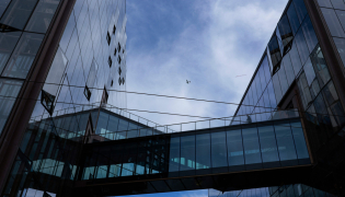 An airplane flies over Open AI headquarters as seen on October 20, 2026 in San Francisco, California. Heather Diehl/Getty Images/AFP
