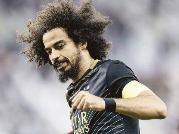 Al Sadd's Akram Afif celebrates after scoring a goal.
