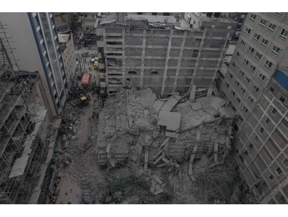 This aerial view shows personell from the Kenya Defence Forces Disaster Response Battalion inspecting the rubble of a collapsed residential building that was still under construction in the Eastleigh neighborhood of Nairobi on October 23,2026. Photo by Tony Karumba / AFP