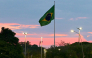 A Brazilian flag flies at sunset in Brasilia on October 24, 2026. (Photo by Pablo Porciuncula / AFP)