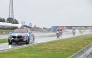 The safety car leads MotoGP riders in a farewell lap following the cancellation of the last Australian MotoGP Grand Prix to be held at Phillip Island on October 25, 2026, due to inclement weather conditions. (Photo by Paul Crock / AFP)