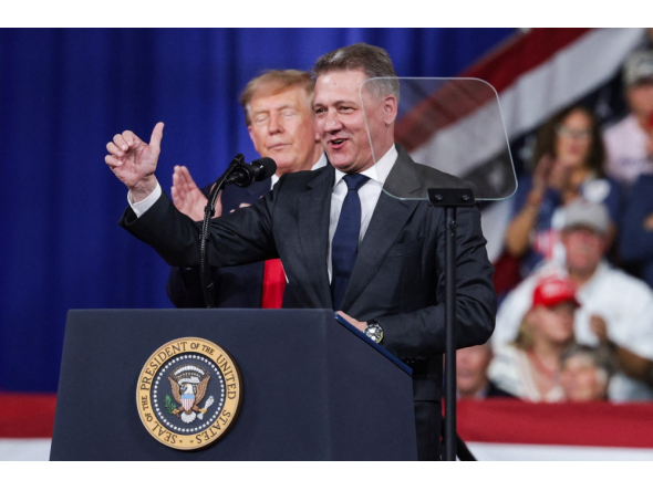 Audi AG CEO Gernot Dollner speaks alongside US President Donald Trump during a midterm campaign rally at the Guardian Centers on October 24, 2026 in Perry, Georgia. Alex Wong/Getty Images/AFP 