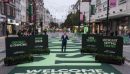 London Mayor Sadiq Khan (C) attends the opening ceremony for a section of Oxford Street, as it goes permanently traffic-free for the first time in central London on October 26, 2026. (Photo by Carlos Jasso / AFP)