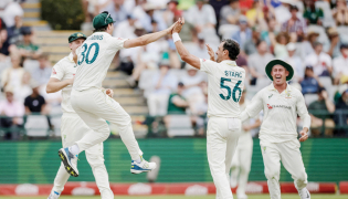 Australia’s Mitchell Starc (second right) celebrates the dismissal of South Africa’s Wiaan Mulder with teammates.