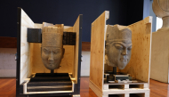 This photo shows two Chinese cultural relics, the head of a military official statue (L) and the head of a civil official statue, returned from Australia, in Canberra, Australia. (Photo by Chu Chen/Xinhua) 