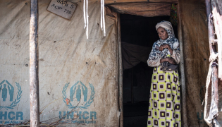 Representational photo showing a displaced Amhara woman stands at the entrance of her tent at the crowded Bakelo Camp for internally displaced people in Debre Berhan, on October 19, 2026. (Photo by Marco Simoncelli / AFP)