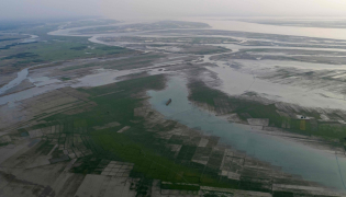 This aerial photograph taken on October 13, 2026, shows wetlands along the Padma river at Ujirpur, near the Bangladesh-India frontier in Bangladesh's Rajshahi division. (Photo by Salahuddin Ahmed / AFP)
