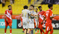 Al Duhail’s Bassam Al-Rawi (centre) celebrates after converting a stoppage-time penalty.   