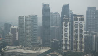 High-rise buildings are seen in Kuala Lumpur on October 20, 2026, as Malaysia continues to be shrouded in haze. (Photo by Mohd Rasfan / AFP)