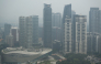 High-rise buildings are seen in Kuala Lumpur on October 20, 2026, as Malaysia continues to be shrouded in haze. (Photo by Mohd Rasfan / AFP)
