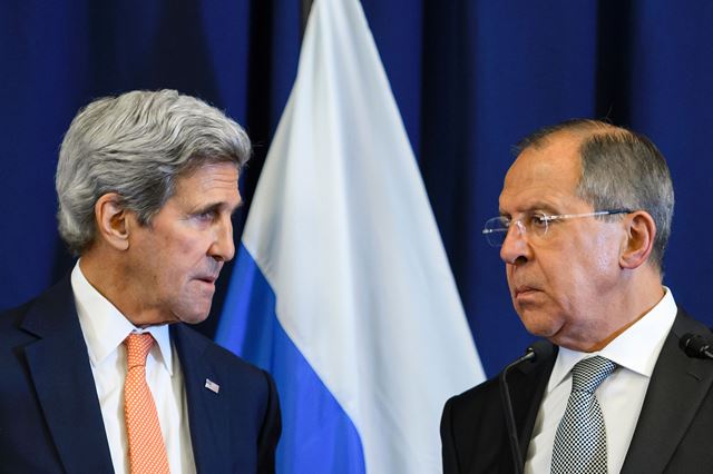 US Secretary of State John Kerry and Russian Foreign Minister Sergei Lavrov look toward one another during a press conference following their meeting in Geneva where they discussed the crisis in Syria on September 9, 2016. AFP / FABRICE COFFRINI