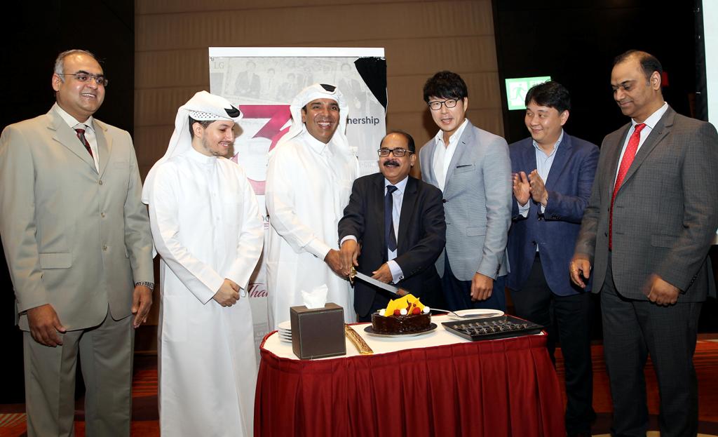  Video Home-Jumbo Electronics Vice Chairman and Managing Director Sajed Jassim Mohammed Sulaiman and  Director and CEO, C V Rappai cuting a ceremonial cake to mark LG Electronics’ 30-year partership with Video Home & Electronic Center during a media event