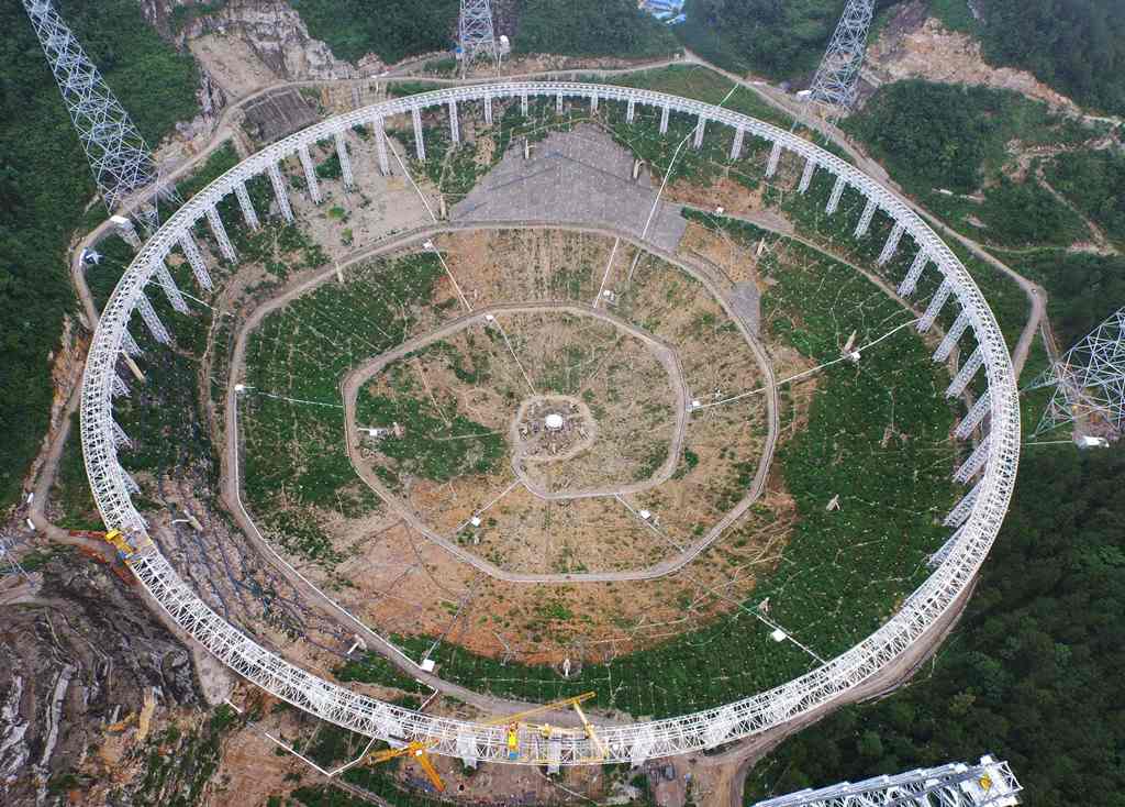 File photo taken on July 29, 2015 shows the five-hundred-metre Aperture Spherical Radio Telescope (FAST) under construction in Pingtang, southwestern China's Guizhou province. China OUT / AFP / STR
