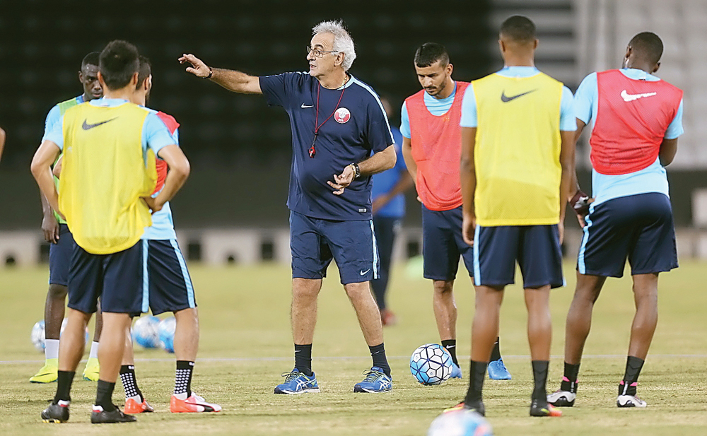 Qatar players train under the watchful eyes of coach Jorge Fossati