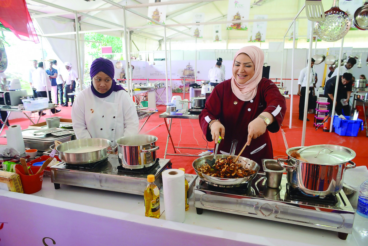 Qatari Chef Aisha Al Tamimi prepares a dish at the International Culinary Festival and Competition in Kochi, India.