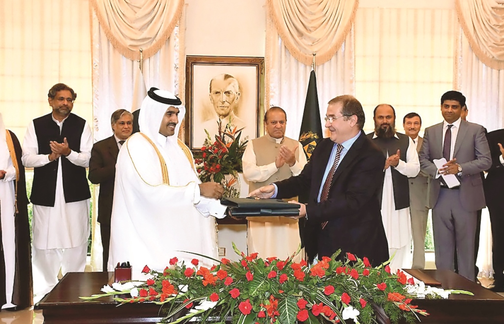 Pakistan Prime Minister Nawaz Sharif witnesses the exchange of documents between Qatar and Pakistan officials after the countries signed the 20-year LNG deal, yesterday.