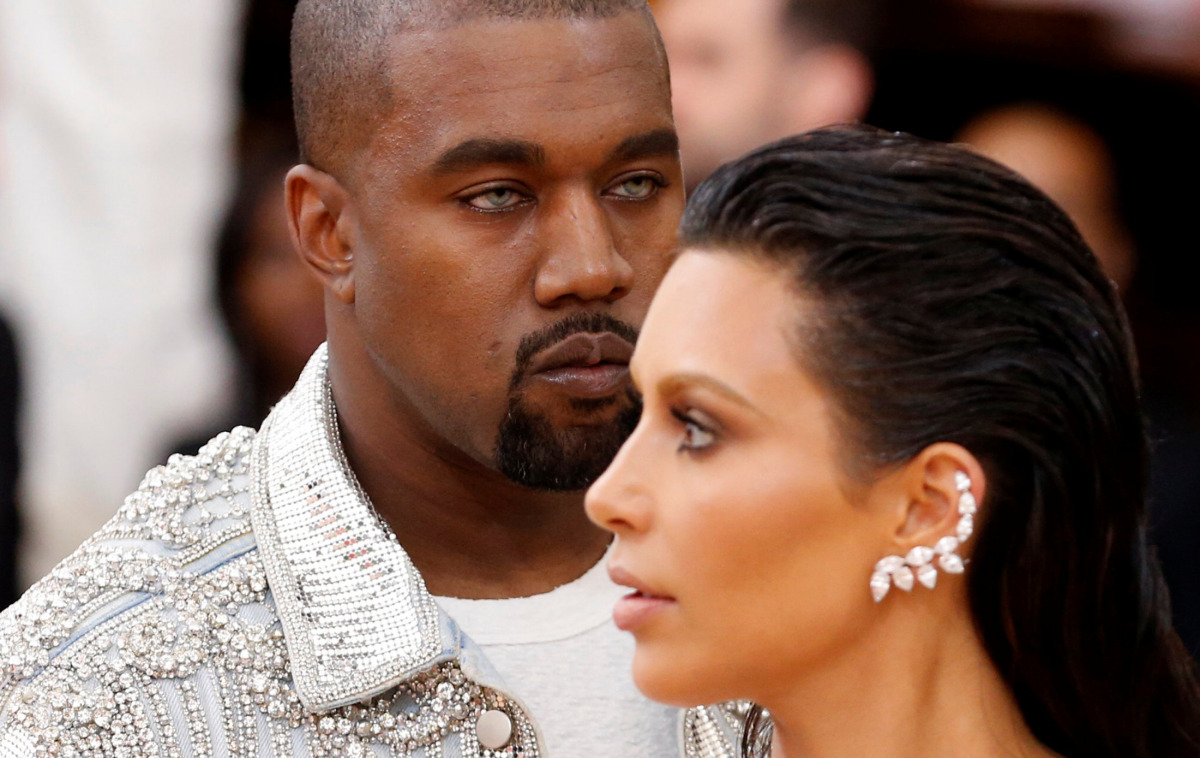 Musician Kanye West (L) and wife Kim Kardashian arrive at the Met Gala to celebrate the opening of 