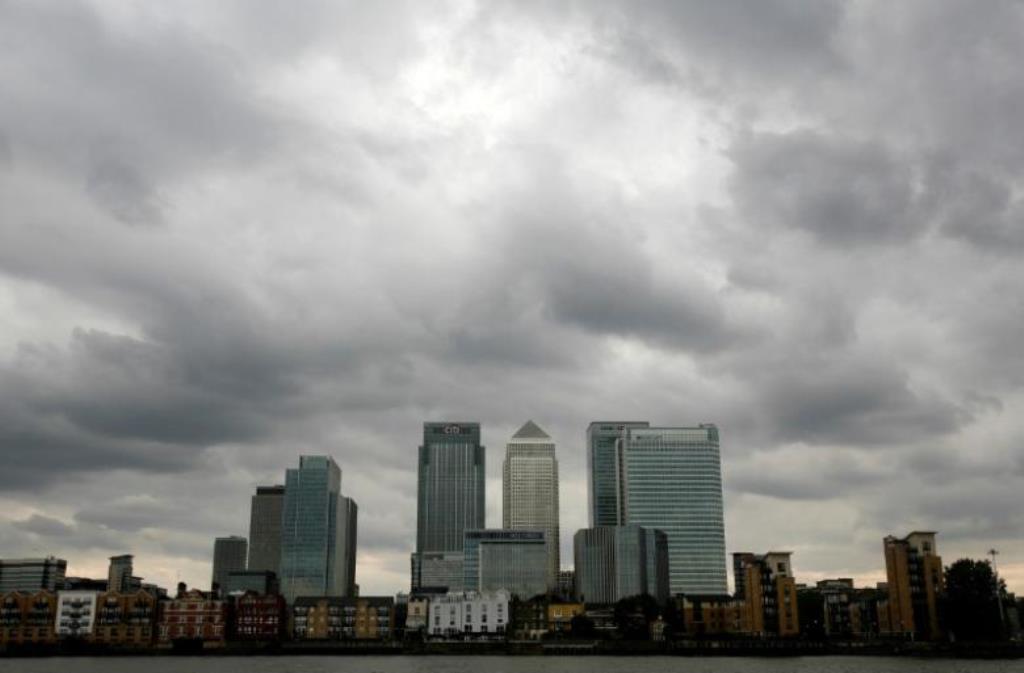 Storm clouds are seen above the Canary Wharf financial district in London, Britain. Reuters/Greg Bos/File Photo
