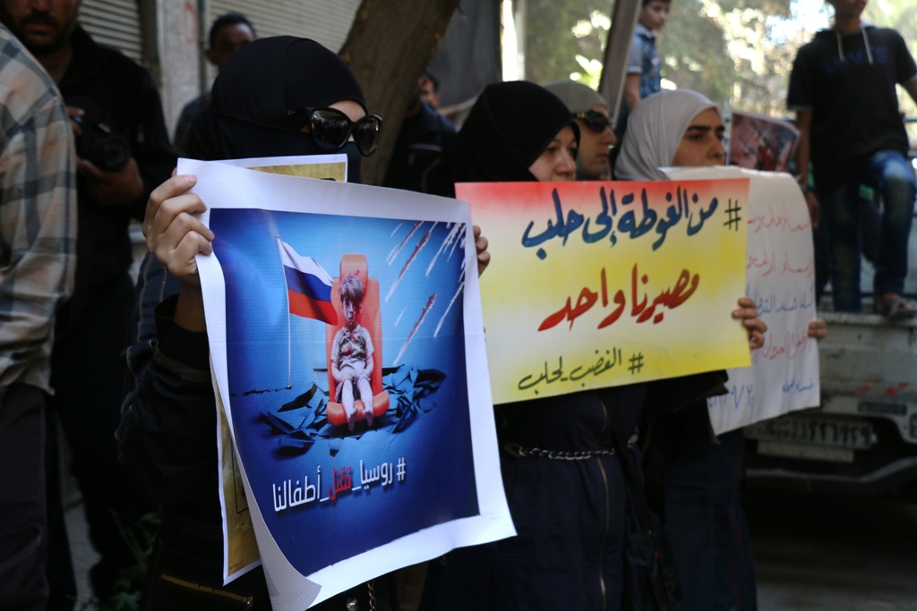 DAMASCUS, SYRIA - SEPTEMBER 30: Syrians stage a protest against Russian airstrikes after friday prayer at eastern Douma of Damascus, Syria on September 30, 2016. ( Samir Tatin - Anadolu Agency )