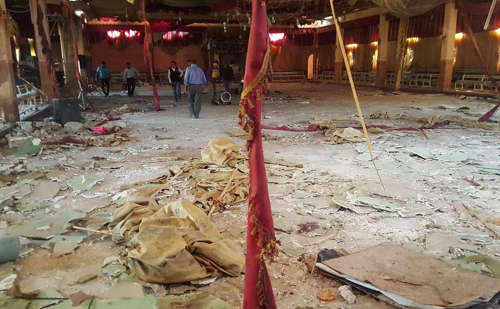 Men inspect the damage at a wedding hall after a suicide attack targeted a Kurdish wedding party in the village of Tall Tawil in the Syrian Hasakeh province. AFP / Ayham al-Mohammad