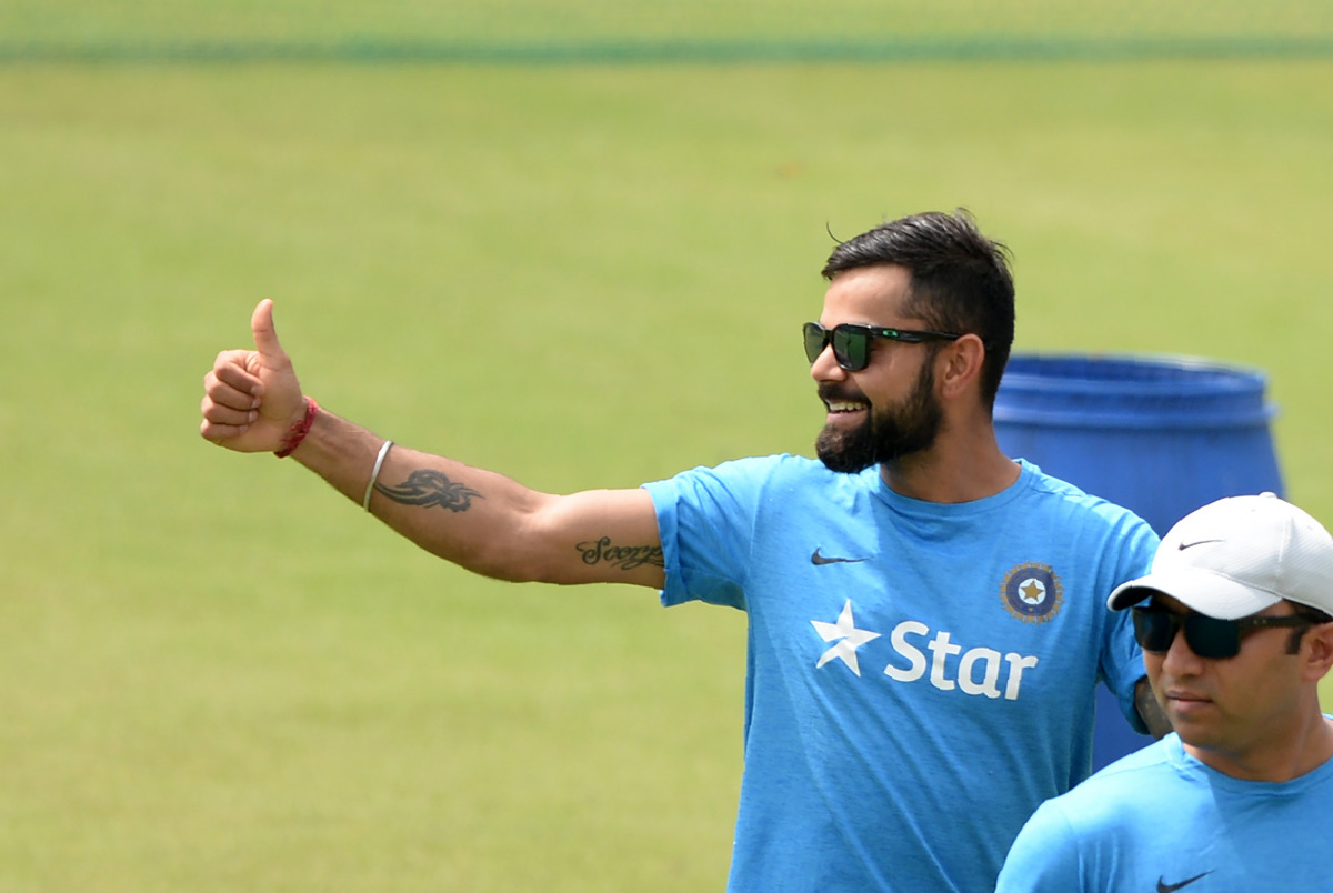 Indian Test captain Virat Kohli gestures during a training session at The Holkar Cricket Stadium in Indore on October 7, 2016. India plays the third Test match against New Zealand from October 8 in Indore. (AFP / PUNIT PARANJPE)