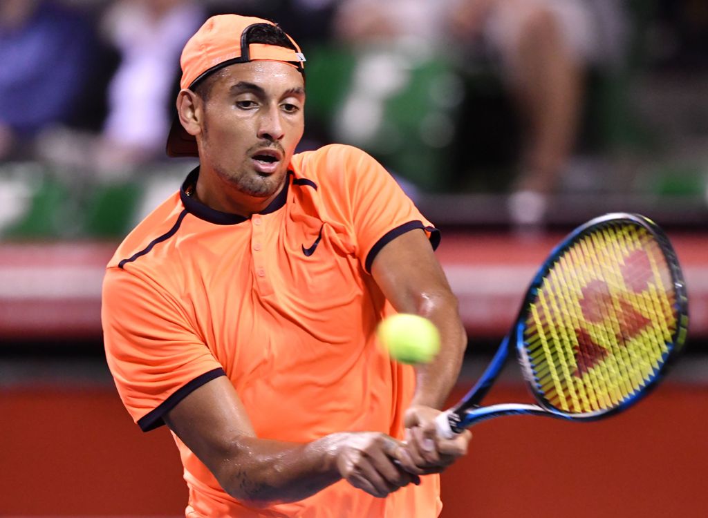 Australia's Nick Kyrgios returns a shot against France's Gael Monfils during their men's singles semi-final match at the ATP Japan Open tennis tournament in Tokyo on October 8, 2016. / AFP / KAZUHIRO NOGI