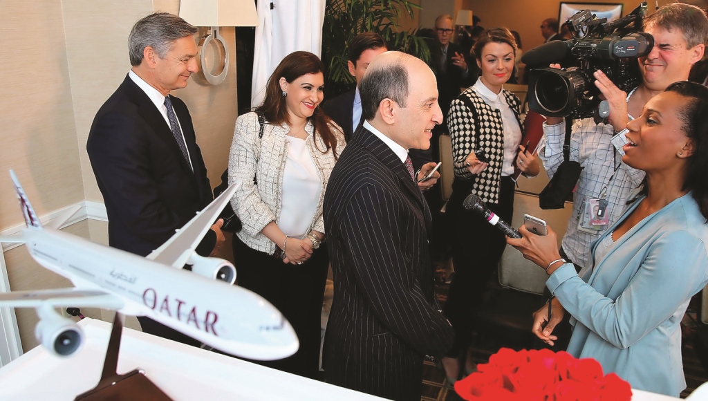 Qatar Airways Group Chief Executive Akbar Al Baker (centre) discusses the agreement with reporters following a press conference co-hosted with Boeing Commercial Airplanes President and CEO Ray Conner.